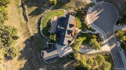 an aerial view of a house with swimming pool