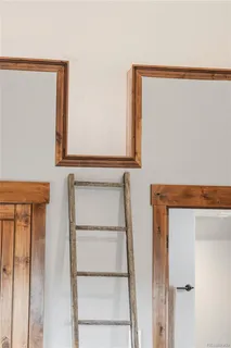 a bathroom with a tub a sink and mirror