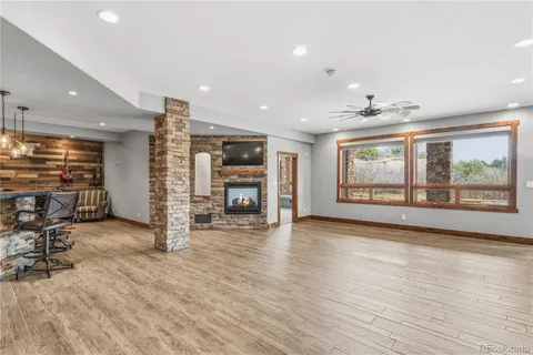 a very nice looking room with a projector and furniture