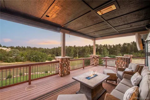 a view of a balcony with wooden floor