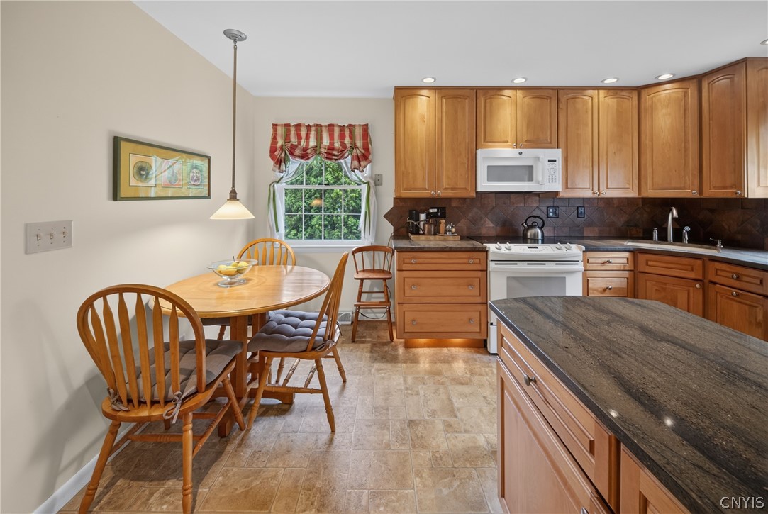4777 Enders Road Manlius, NY 13104 - Photo 14 of 48 Updated kitchen includes motion sensor lighting below the cabinetry...