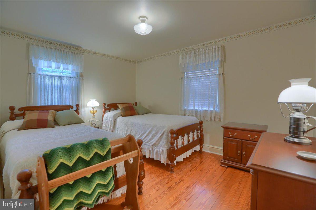 43 East Lemon Street Lititz, PA 17543 - Photo 23 of 27 a bedroom with two beds and a lamp on dresser