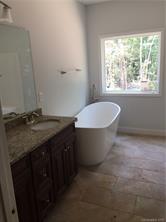 2085 Cedar Road York, SC 29745 - Photo 6 of 13 a bathroom with a granite countertop sink and a mirror
