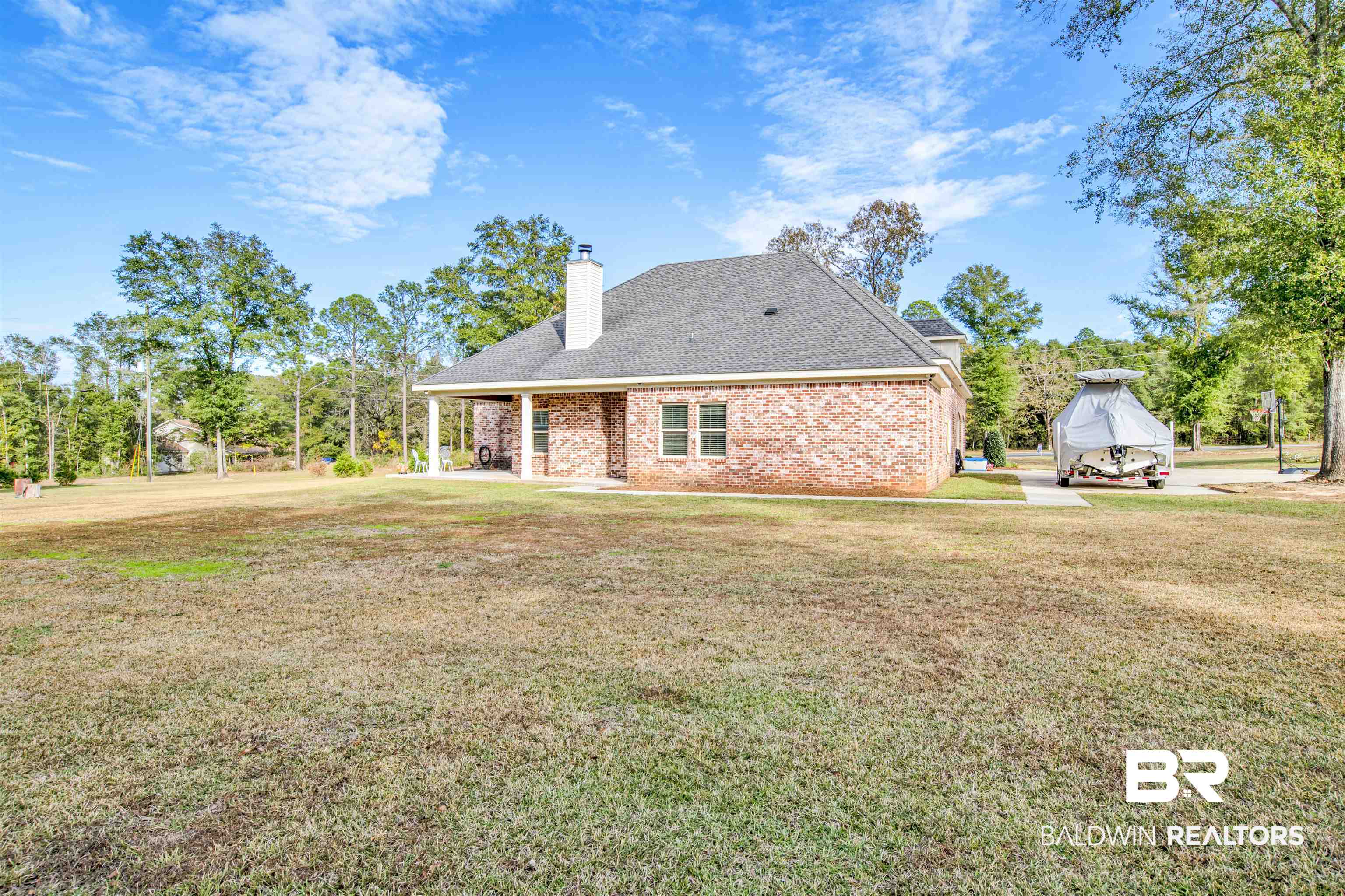 2440 Johnson Road West Mobile, AL 36695 - Photo 39 of 40 Back of house featuring a lawn