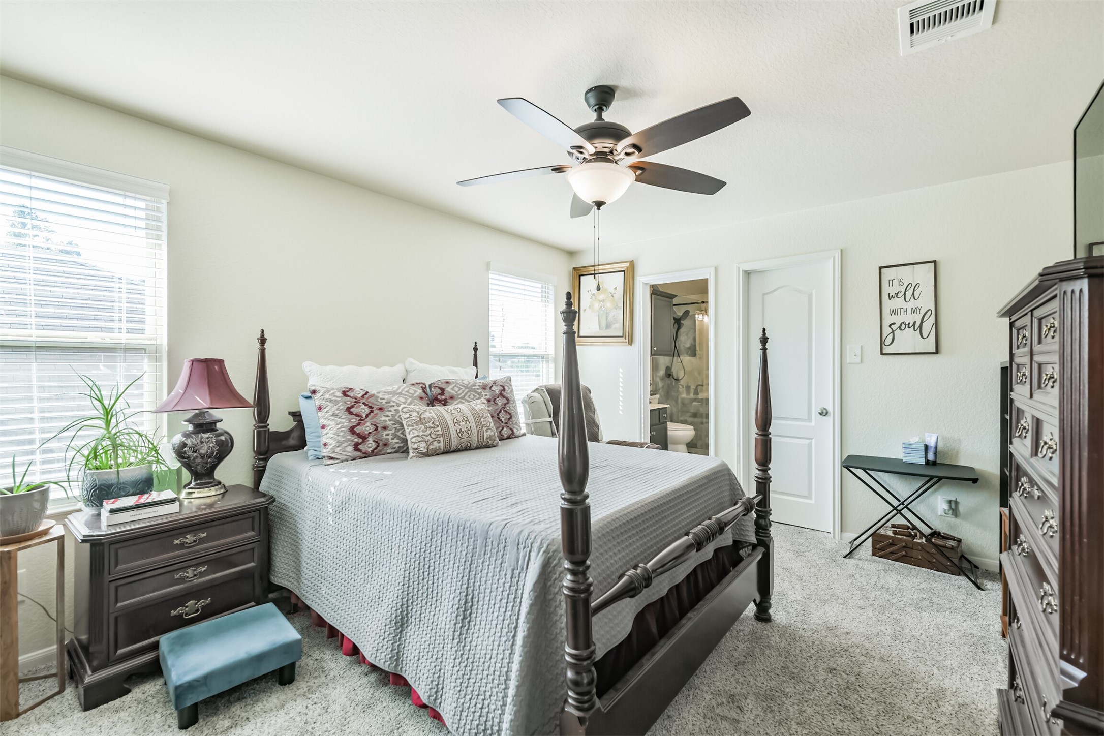 24047 Schults Meadow Lane Spring, TX 77389 - Photo 36 of 47 a bedroom with a bed and a chandelier