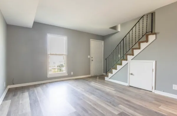 a view of room with window and hardwood floor