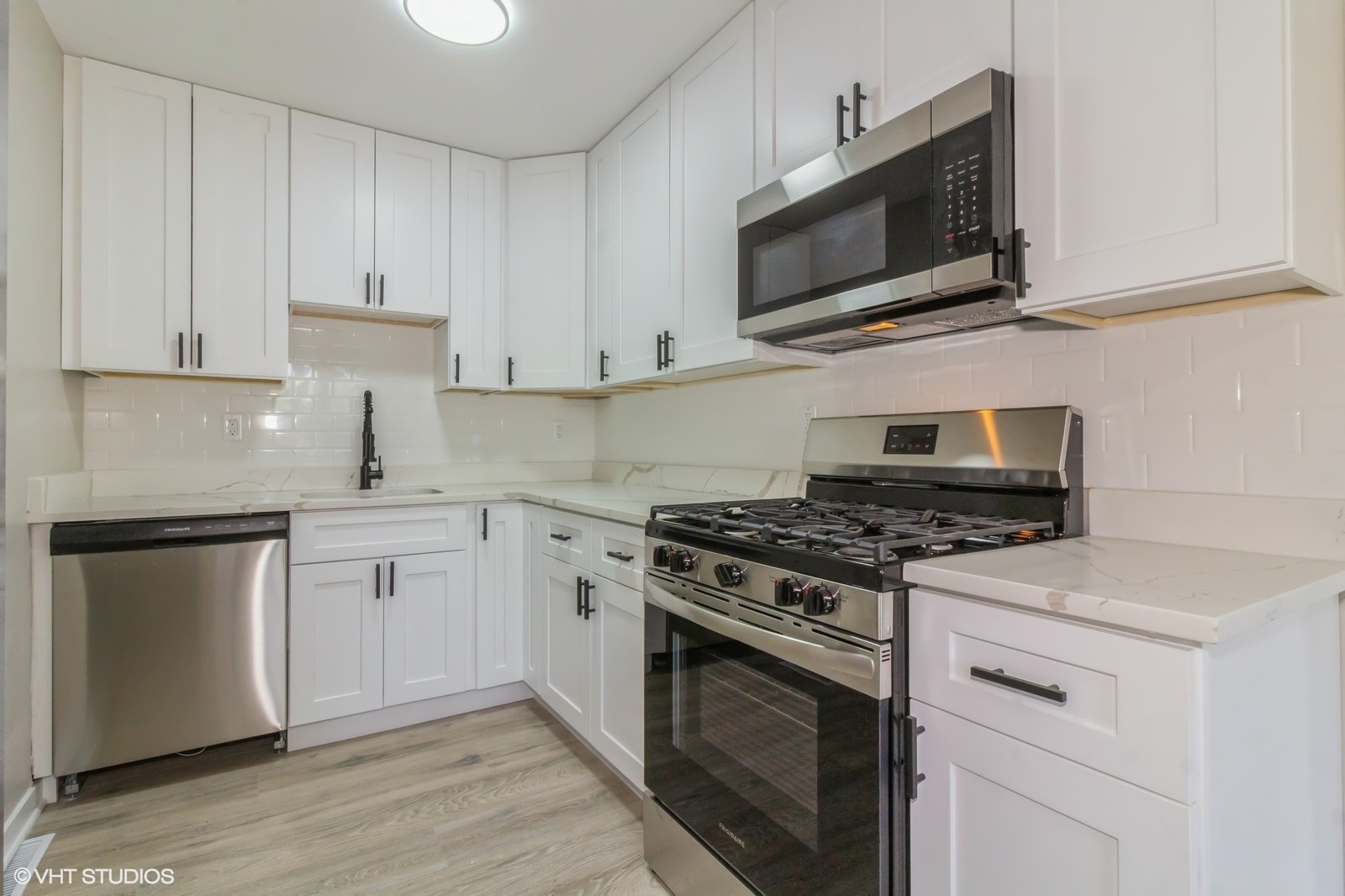 26 Hampton Road Montgomery, IL 60538 - Photo 4 of 11 a kitchen with cabinets stainless steel appliances and wooden floor