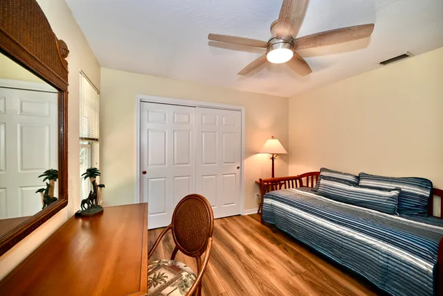 a bedroom with furniture and a chandelier