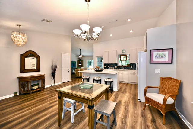 a view of a dining room with furniture and a fireplace