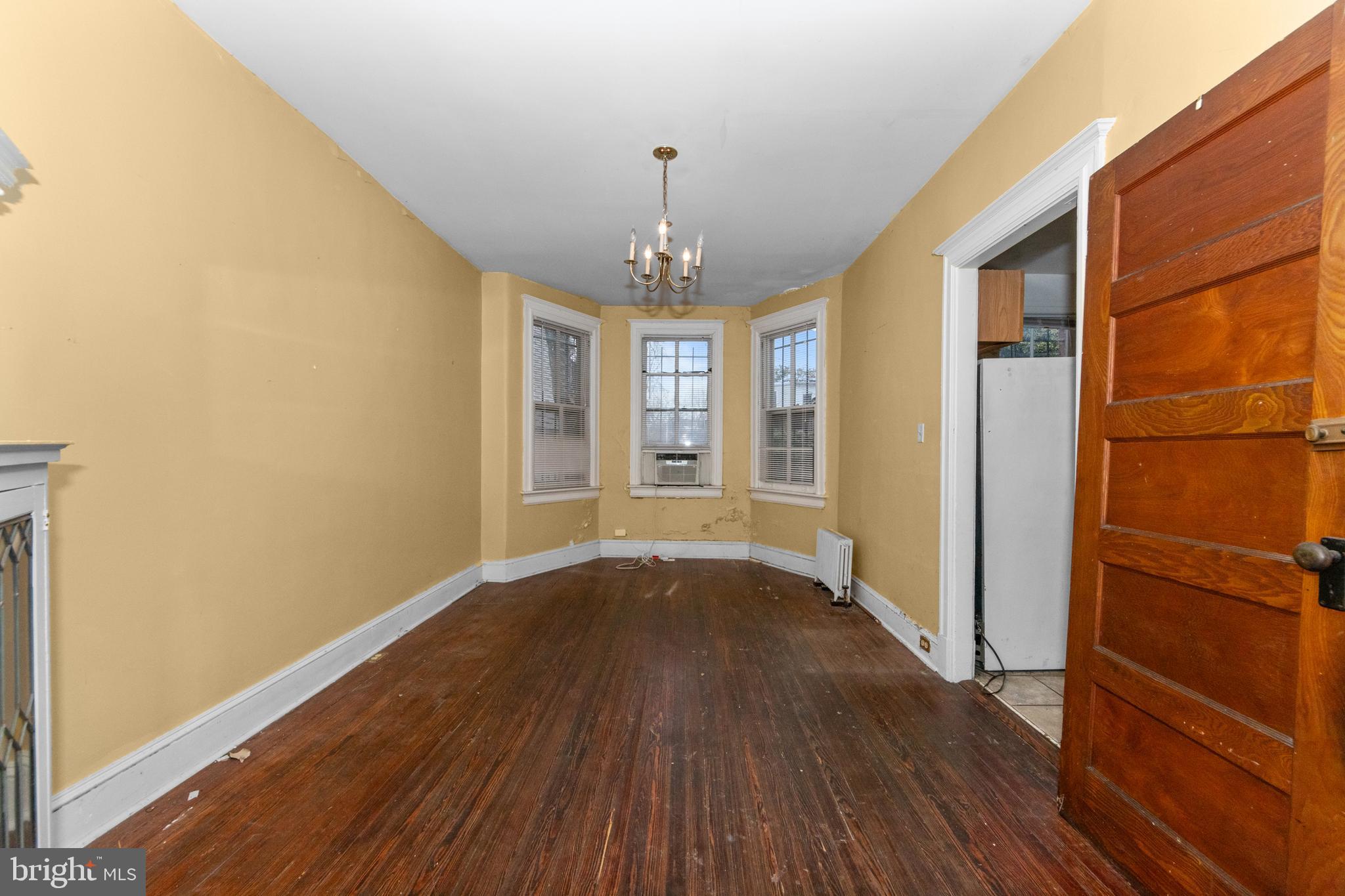 1014 Independence Avenue Southeast Washington, DC 20003 - Photo 12 of 51 wooden floor in an empty room with a window