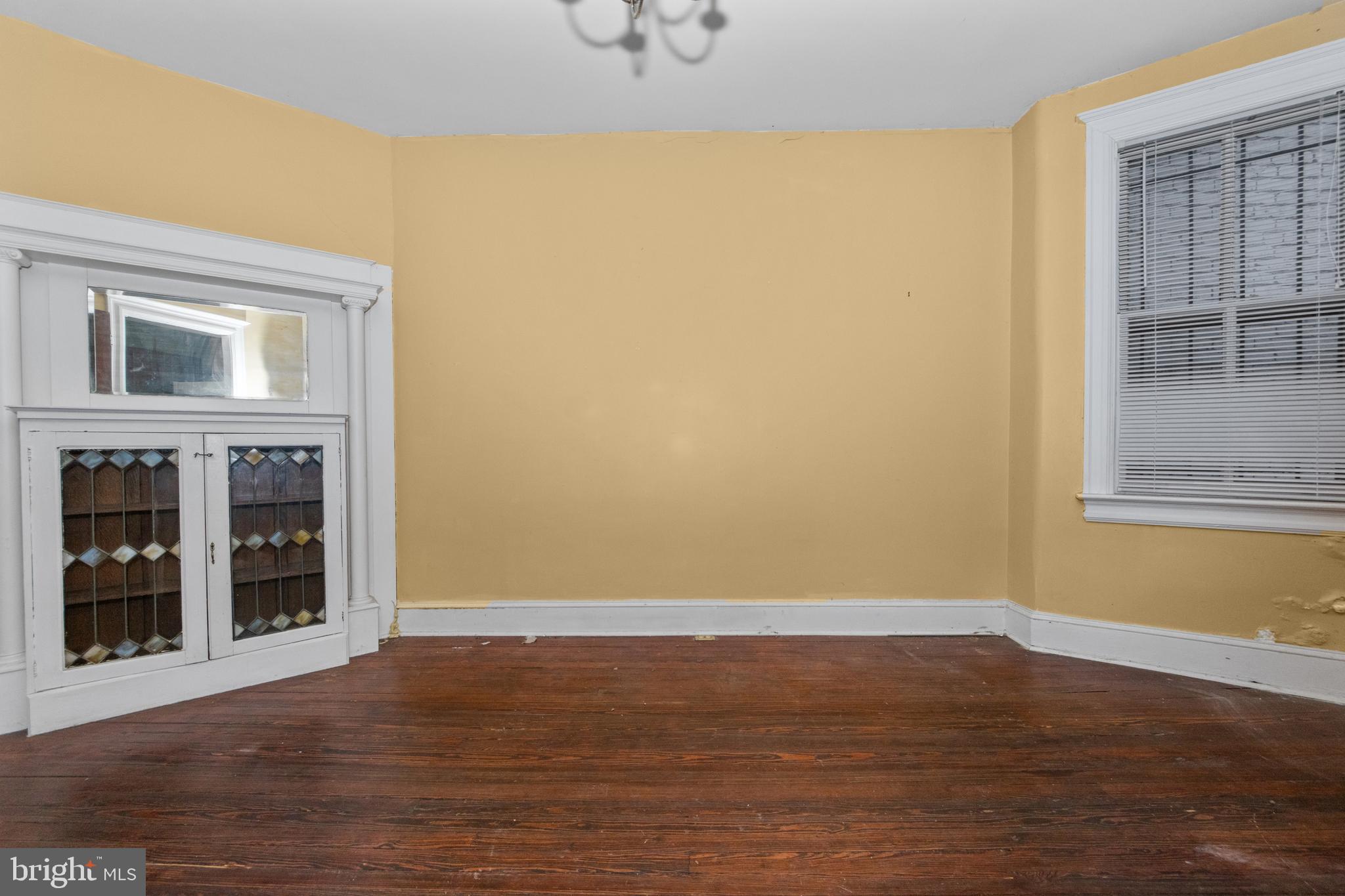 1014 Independence Avenue Southeast Washington, DC 20003 - Photo 14 of 51 a view of an empty room with wooden floor and a window