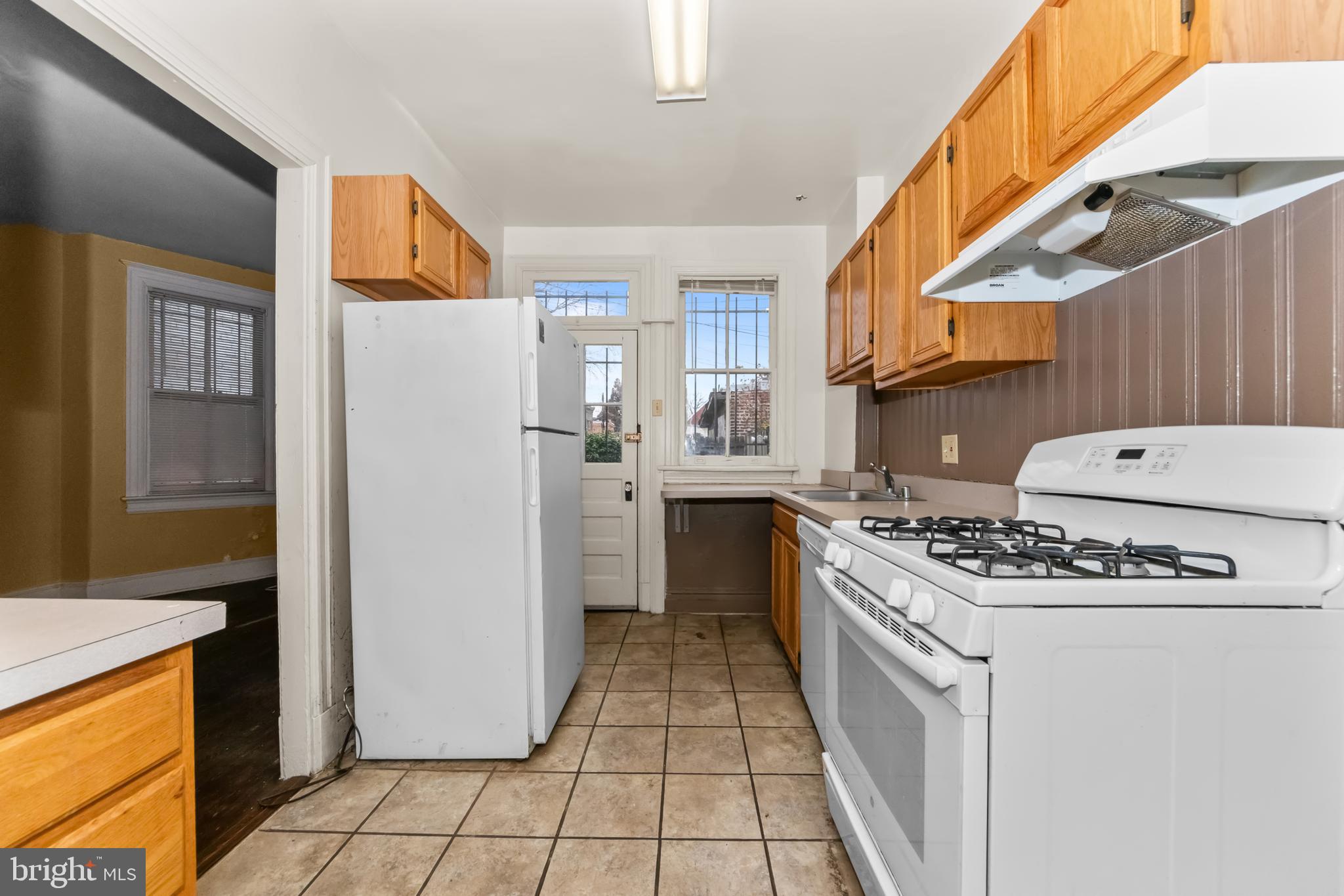 1014 Independence Avenue Southeast Washington, DC 20003 - Photo 16 of 51 a kitchen with a stove top oven and refrigerator