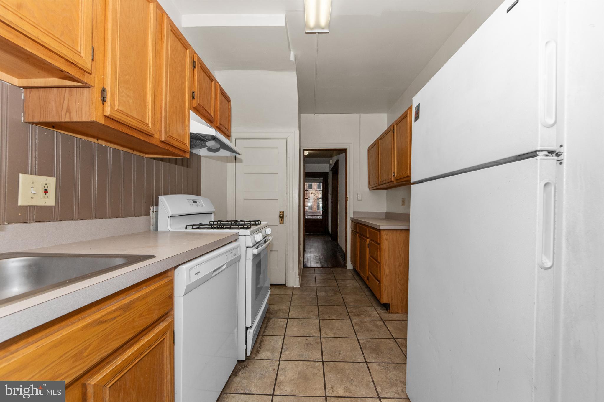 1014 Independence Avenue Southeast Washington, DC 20003 - Photo 17 of 51 a kitchen with a sink refrigerator and cabinets