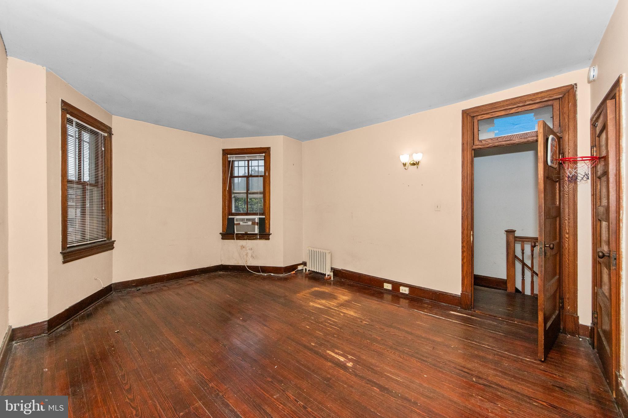 1014 Independence Avenue Southeast Washington, DC 20003 - Photo 20 of 51 an empty room with wooden floor and windows