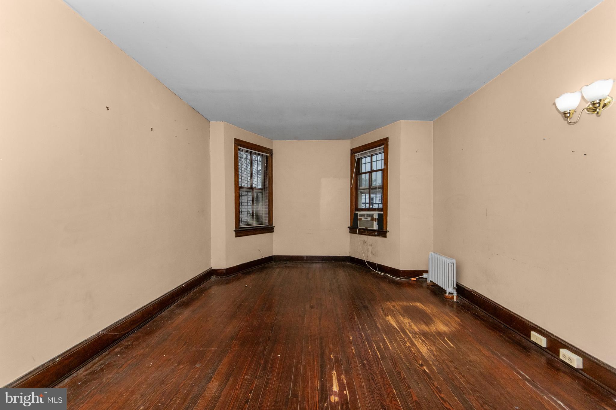 1014 Independence Avenue Southeast Washington, DC 20003 - Photo 21 of 51 an empty room with wooden floor and windows