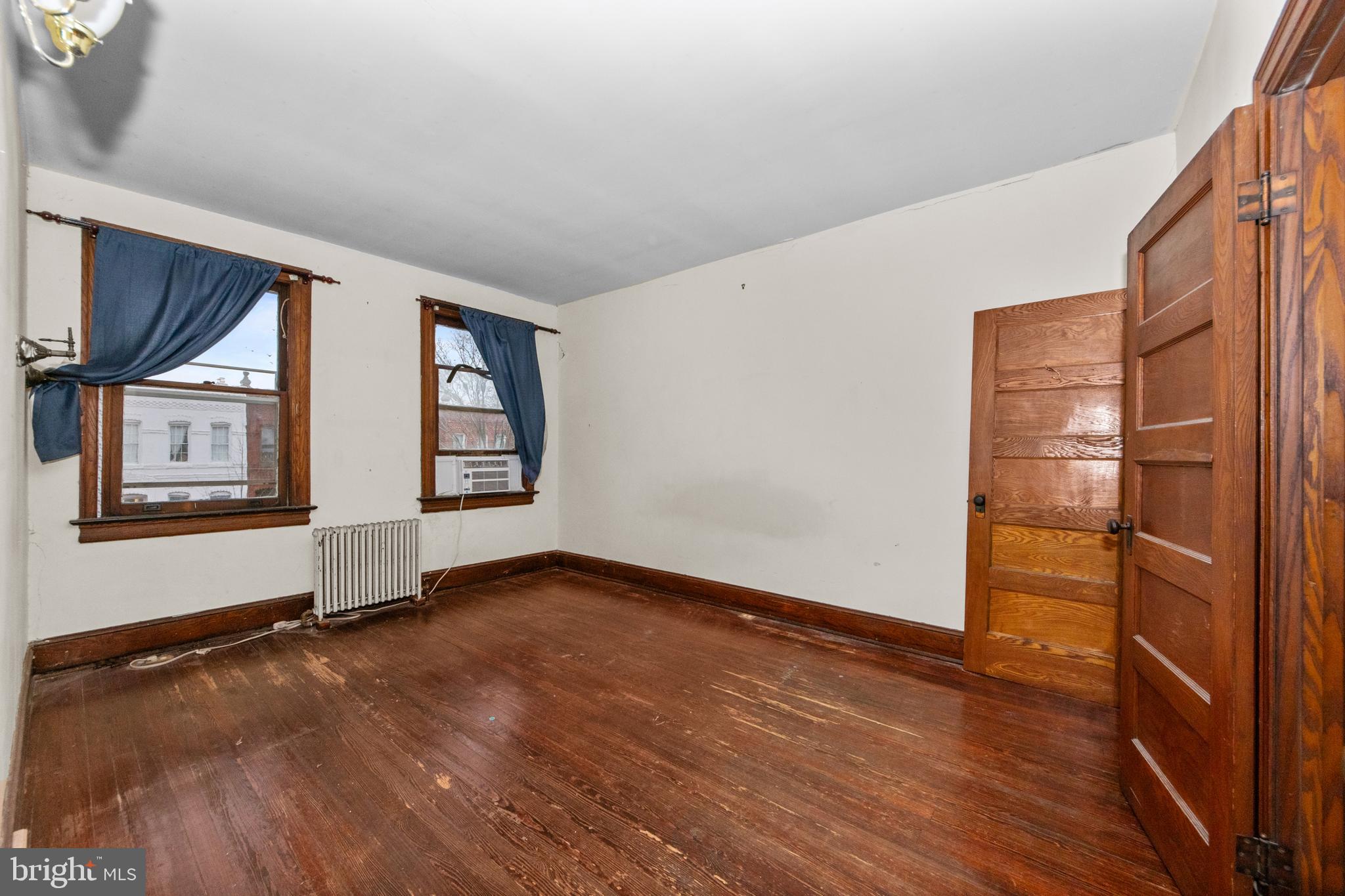 1014 Independence Avenue Southeast Washington, DC 20003 - Photo 22 of 51 an empty room with wooden floor and windows