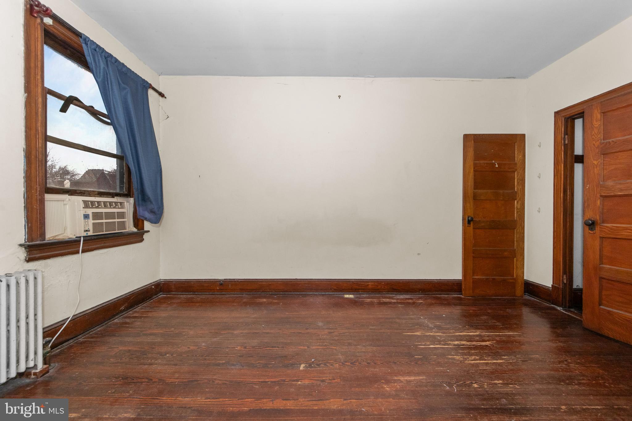 1014 Independence Avenue Southeast Washington, DC 20003 - Photo 23 of 51 a view of an empty room with wooden floor and a window
