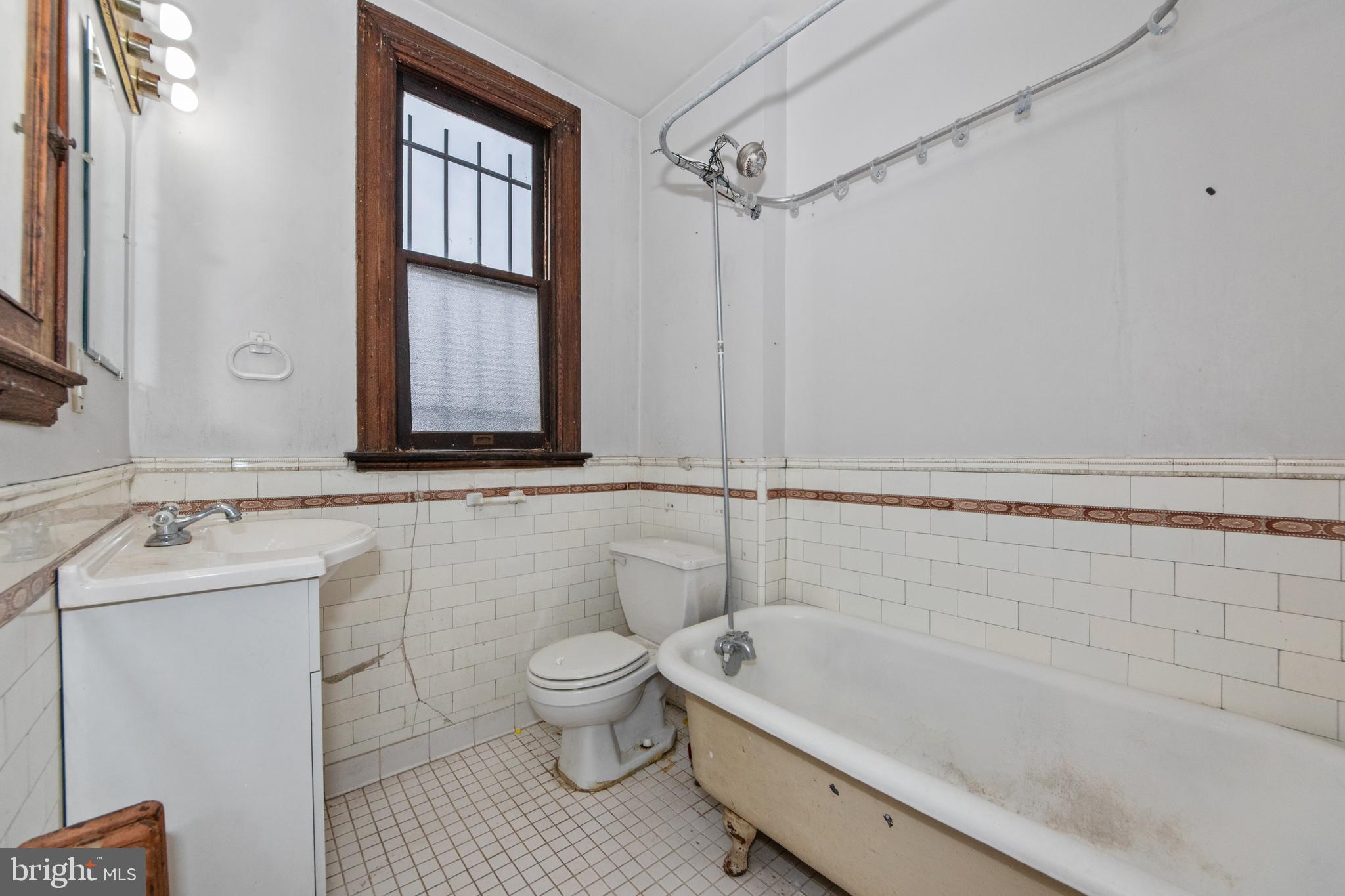 1014 Independence Avenue Southeast Washington, DC 20003 - Photo 30 of 51 a bathroom with a granite countertop sink a toilet and bathtub