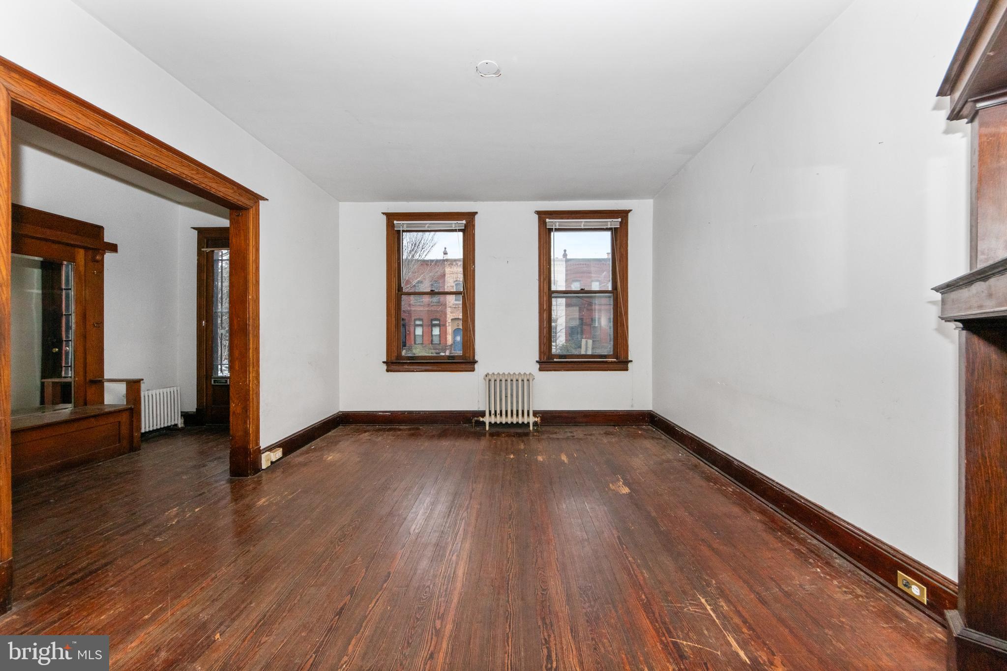 1014 Independence Avenue Southeast Washington, DC 20003 - Photo 10 of 51 an empty room with wooden floor and windows
