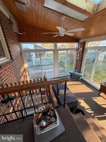 a room with furniture and a large window