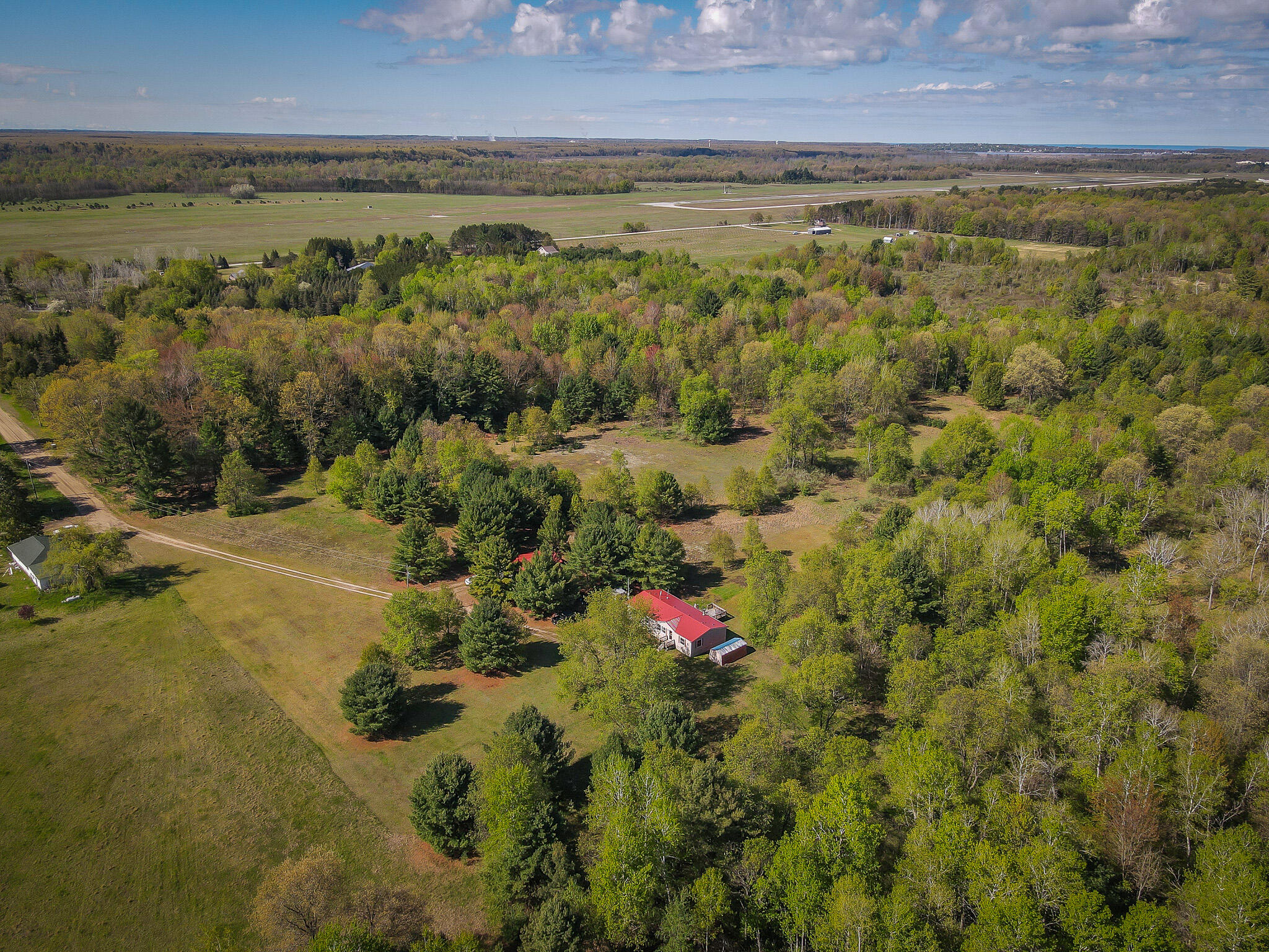 2314 Revolt Road Manistee, MI 49660 - Photo 4 of 48 dji_fly_20240510_103030_902_171535144587