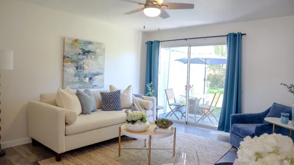 a living room with furniture and a large window