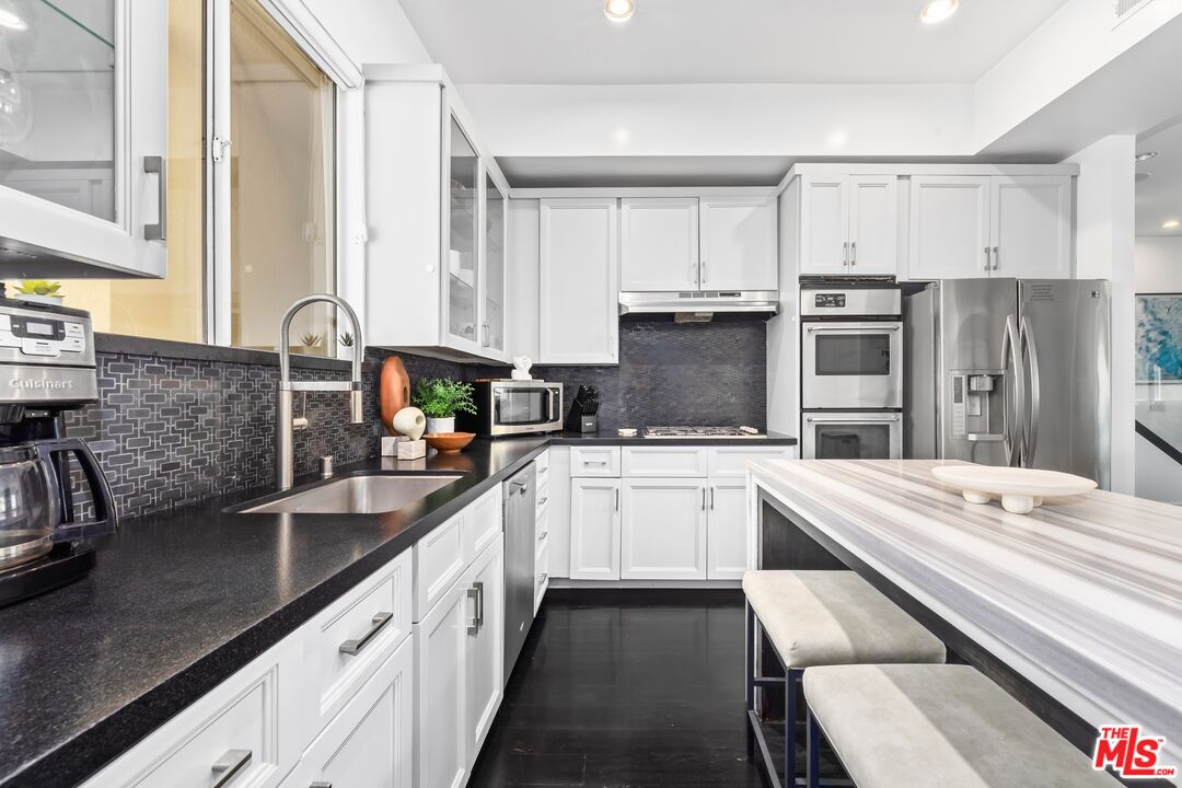 32 Galleon Street Marina del Rey, CA 90292 - Photo 9 of 24 a kitchen with a sink stove and refrigerator