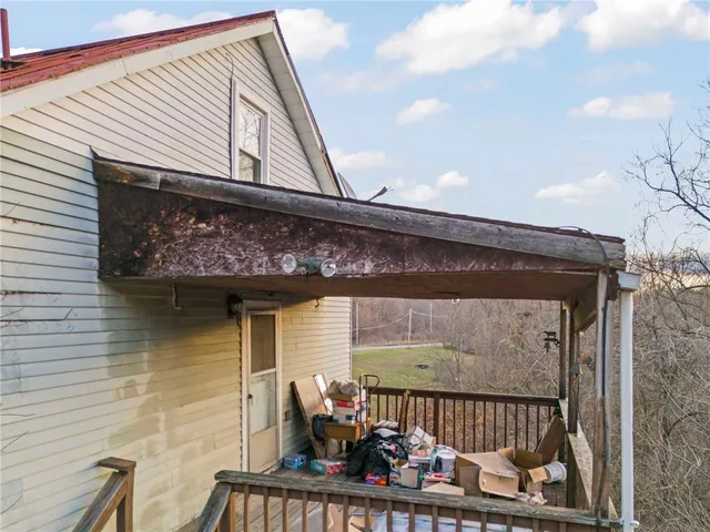 a living room with furniture a rug and a chandelier