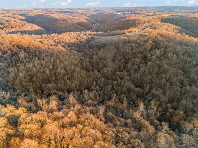 a view of a house with wooden fence