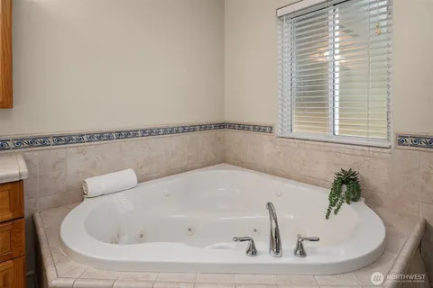 a white bath tub sitting in a bathroom