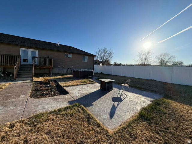 2095 West 4100 North Spring Glen, UT 84526 - Photo 23 of 35 Fenced backyard with a patio area and a deck