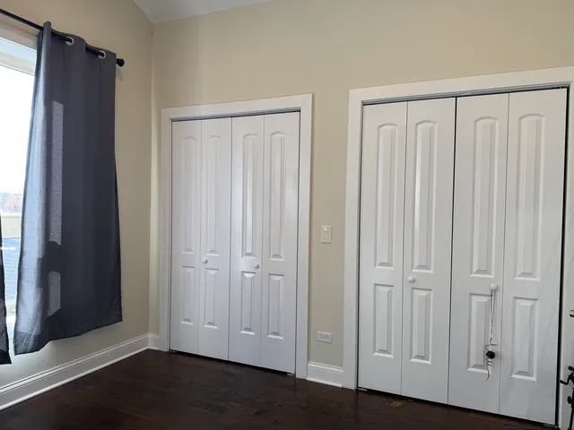 a view of a elevator with wooden floor