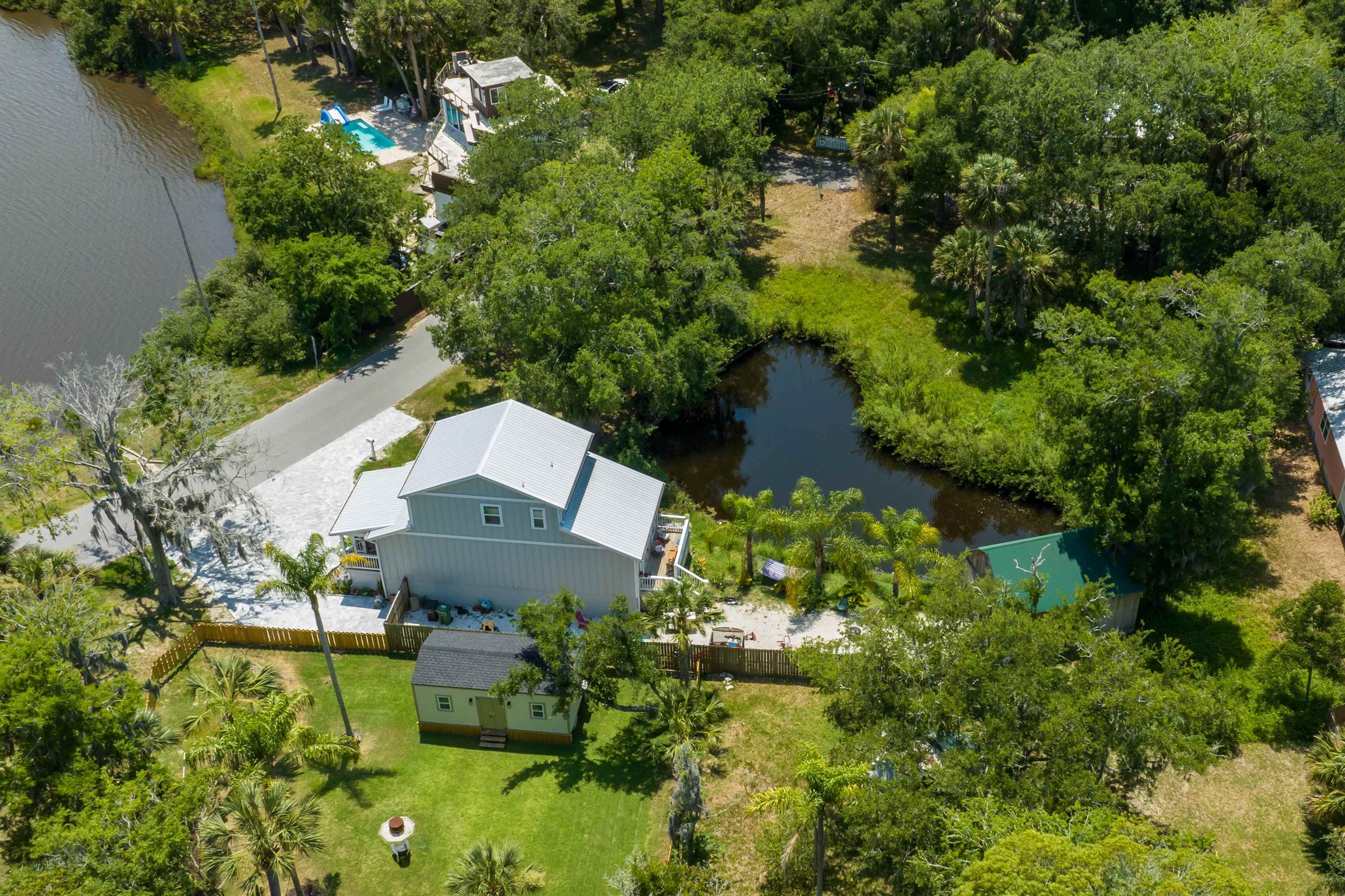 27 Davis Street St. Augustine, FL 32084 - Photo 7 of 14 an aerial view of a house with a yard and lake view