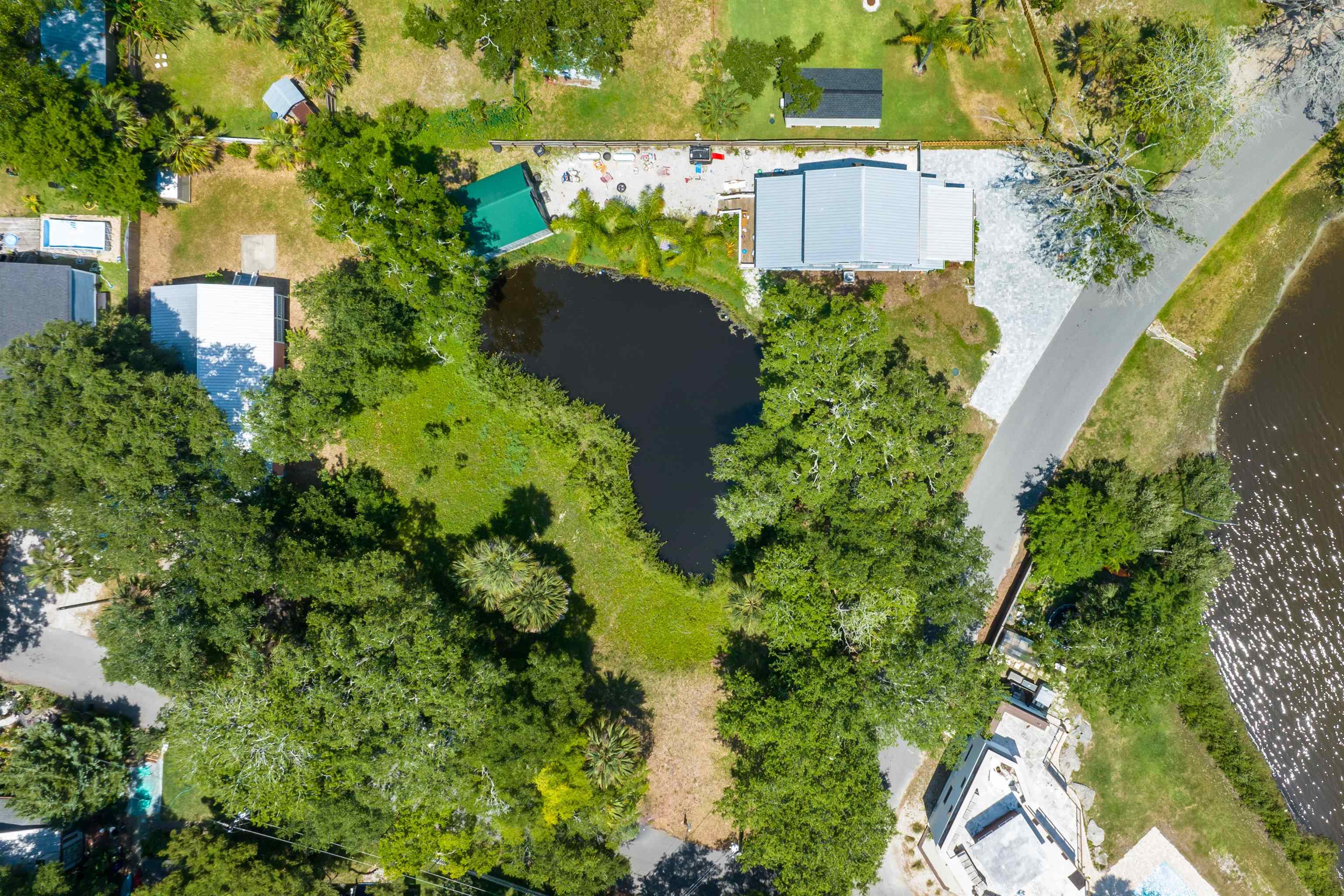 27 Davis Street St. Augustine, FL 32084 - Photo 8 of 14 an aerial view of a house with a yard and garden