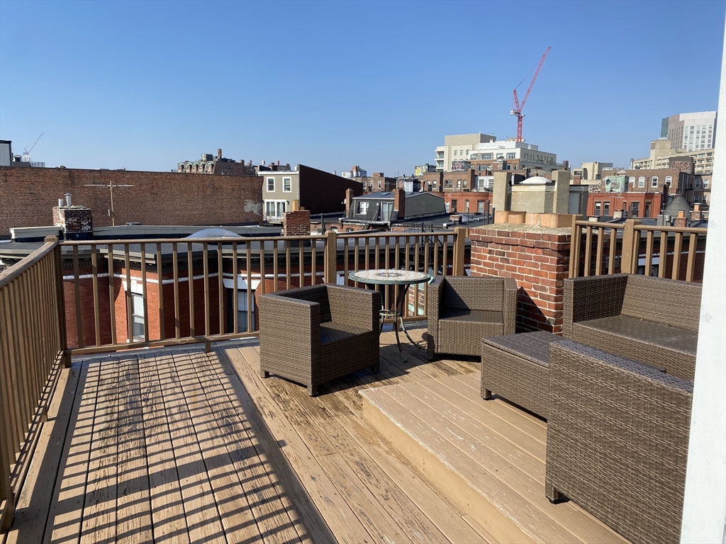 57 Gainsborough Street, Unit 2 Boston, MA 02115 - Photo 8 of 8 a view of a balcony with wooden floor