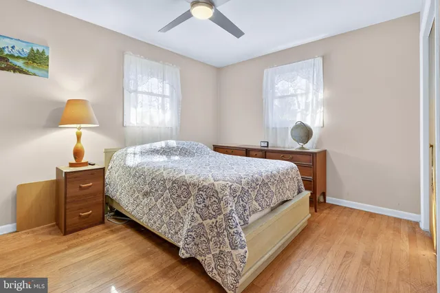 a bedroom with bed and window