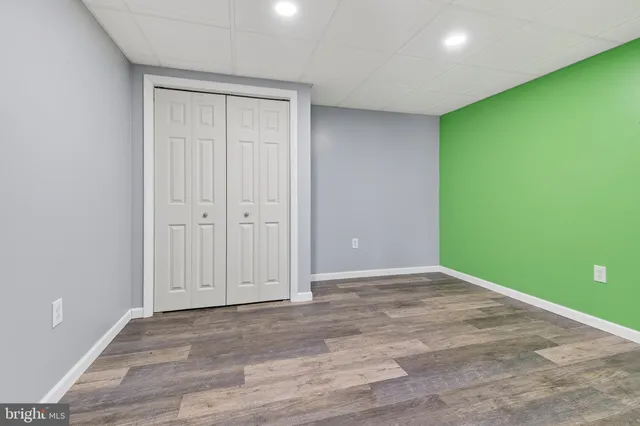 a view of room with window and hardwood