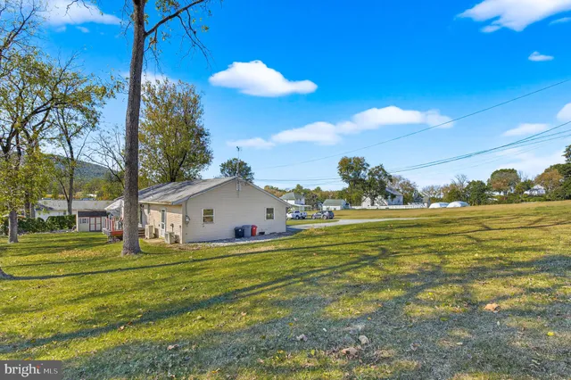a view of a house with a big yard