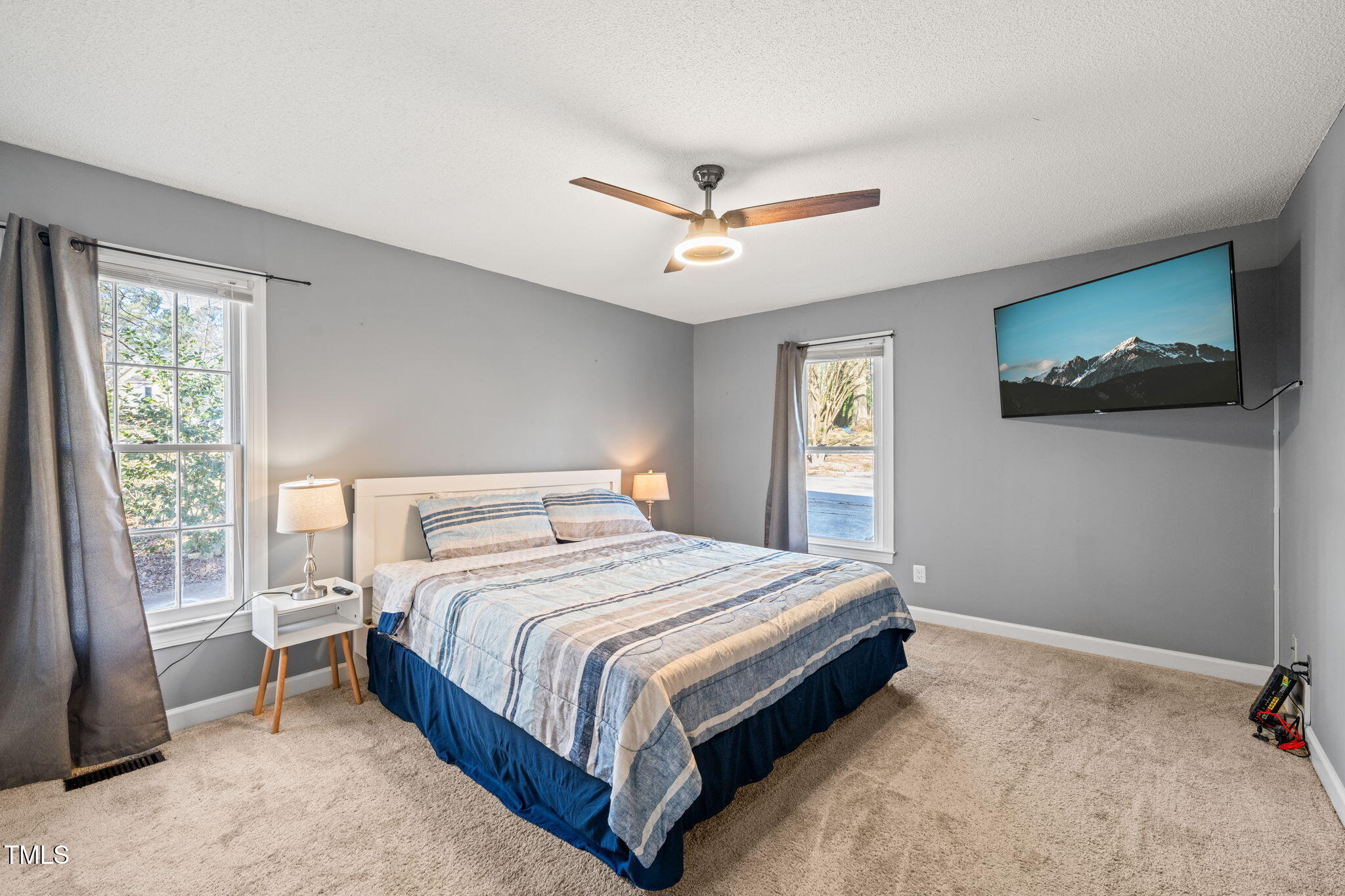 3701 East Jameson Road Raleigh, NC 27604 - Photo 12 of 26 a bedroom with a large bed and a window