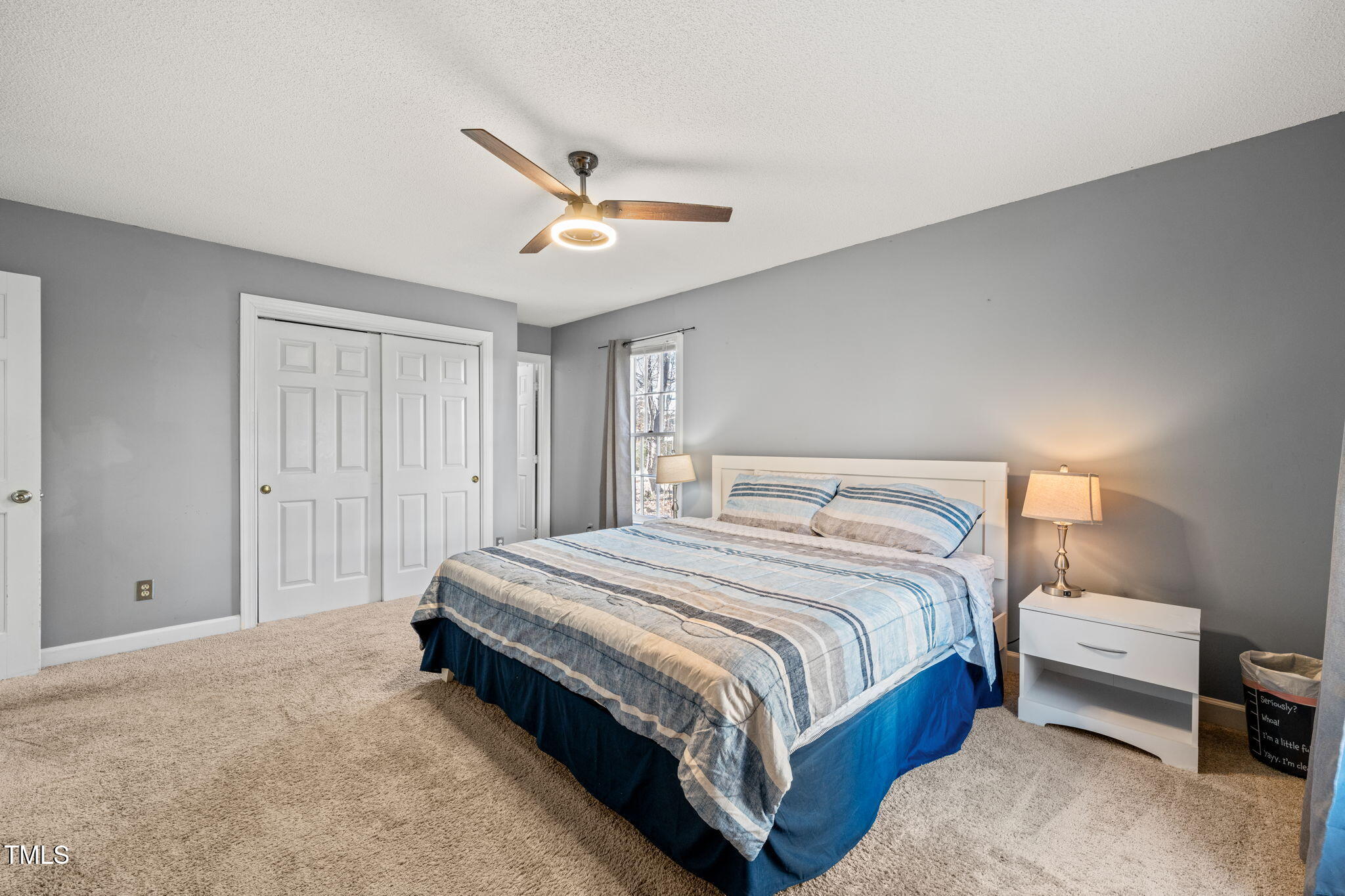 3701 East Jameson Road Raleigh, NC 27604 - Photo 13 of 26 a bedroom with a bed and a chandelier