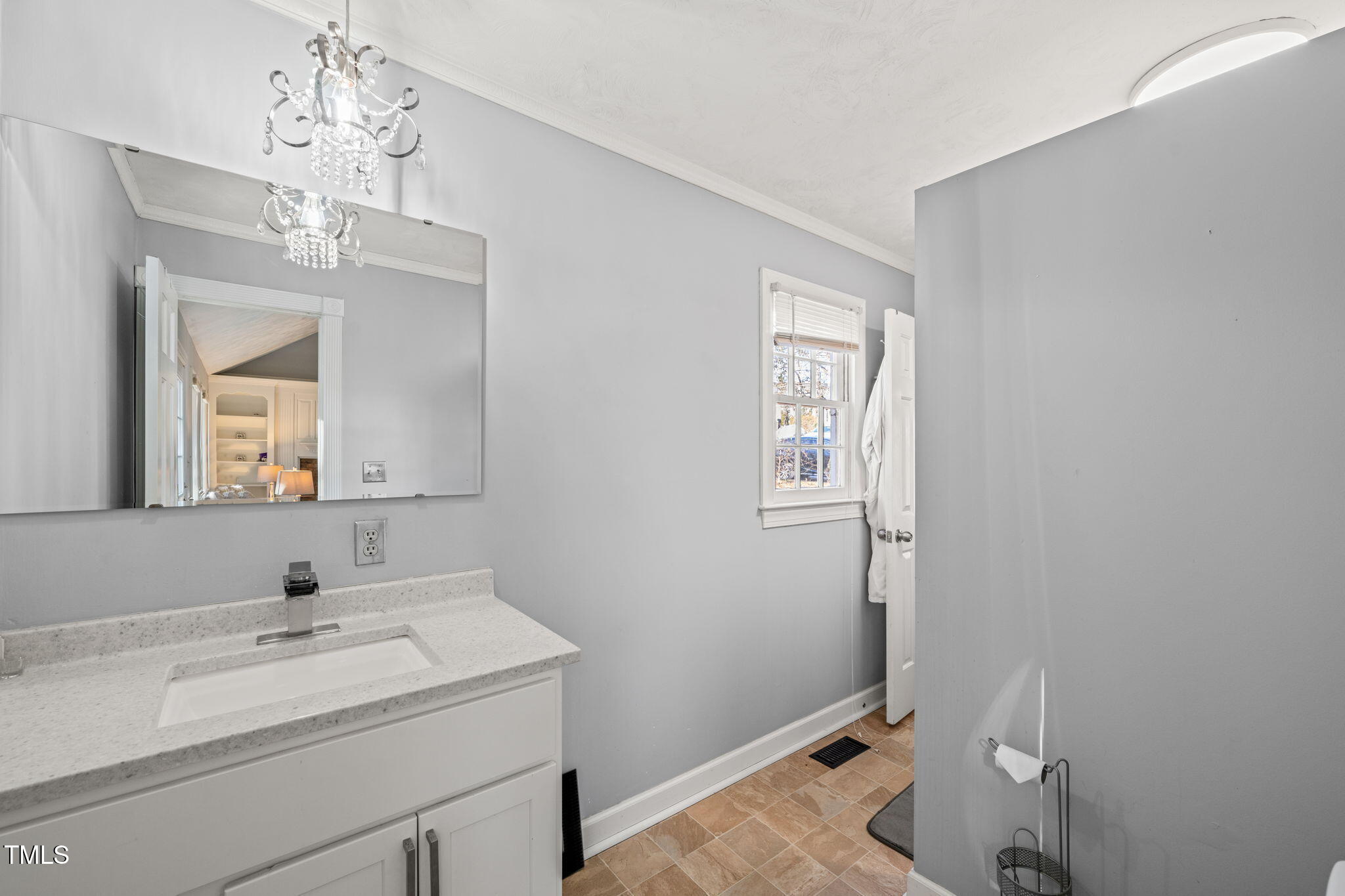 3701 East Jameson Road Raleigh, NC 27604 - Photo 14 of 26 a bathroom with a sink and a mirror