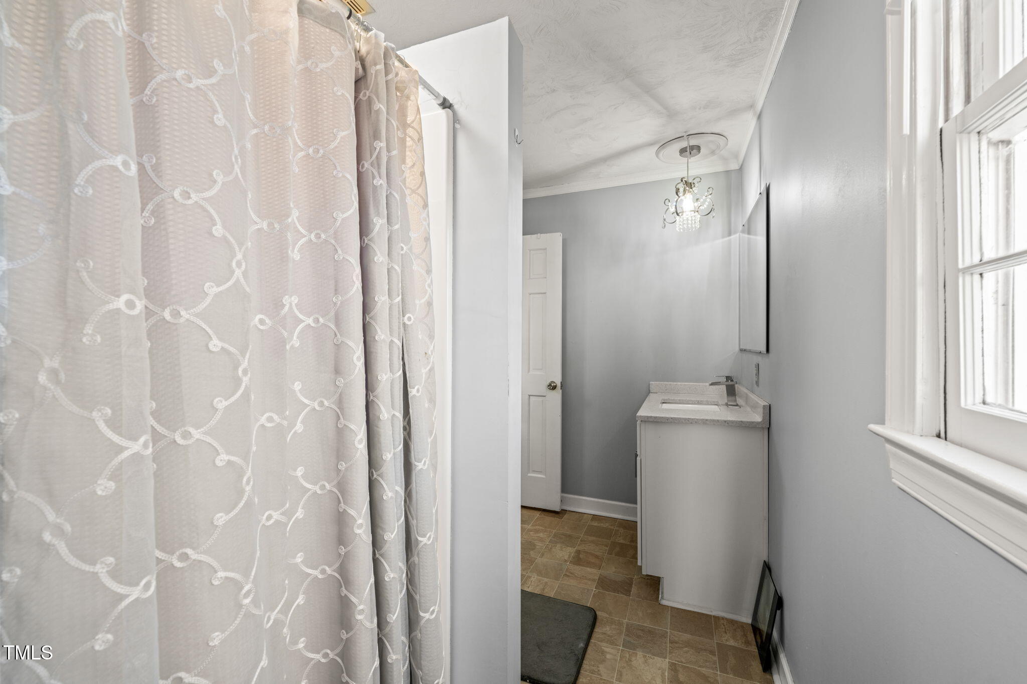 3701 East Jameson Road Raleigh, NC 27604 - Photo 15 of 26 a view of bathroom with a shower and a sink