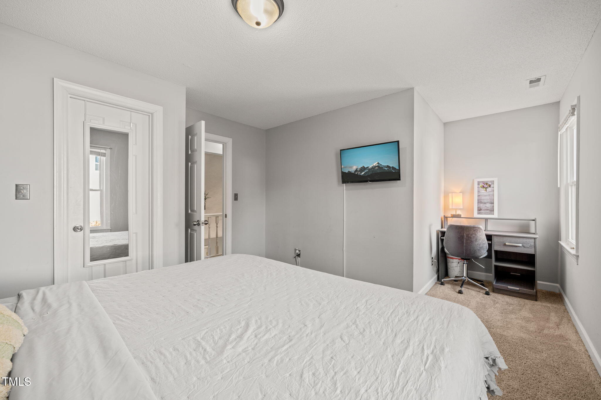 3701 East Jameson Road Raleigh, NC 27604 - Photo 20 of 26 a bedroom with a bed and a workspace