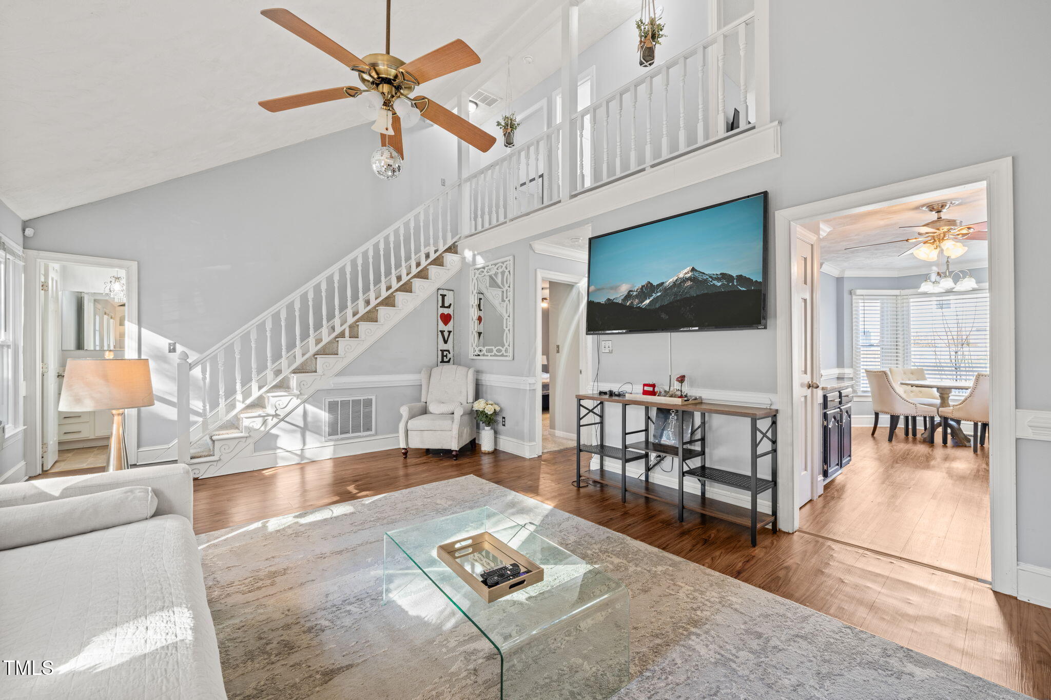 3701 East Jameson Road Raleigh, NC 27604 - Photo 5 of 26 a living room with furniture and a flat screen tv