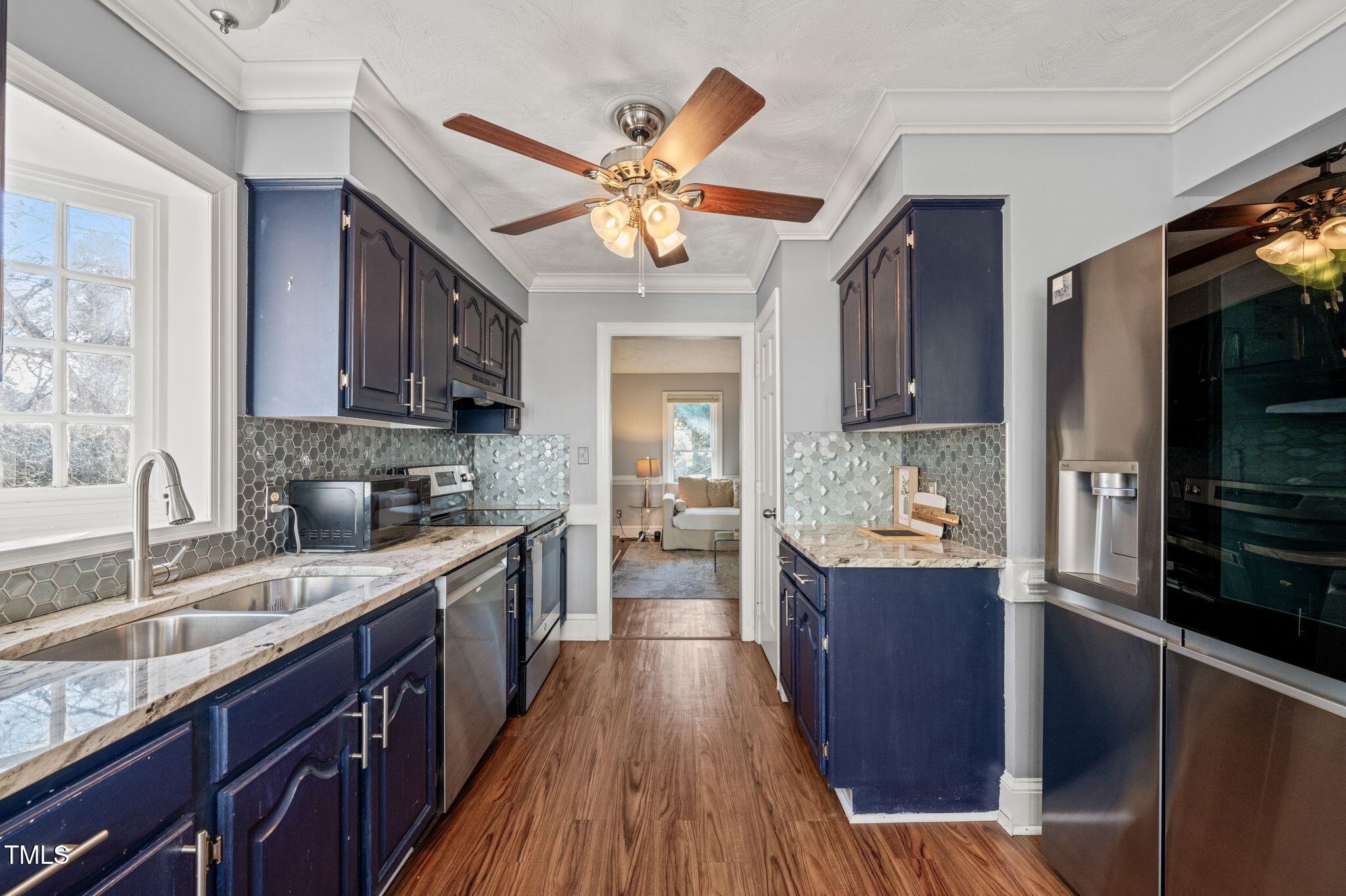 3701 East Jameson Road Raleigh, NC 27604 - Photo 6 of 26 a kitchen with stainless steel appliances a sink dishwasher stove and refrigerator