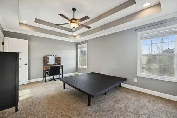 a view of work space with furniture and window