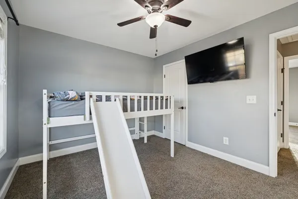 a view of a livingroom with a flat screen tv
