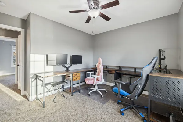a view of a workspace with furniture
