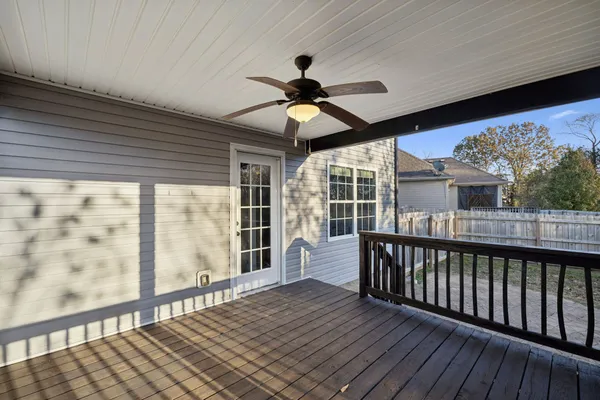 a view of a porch with wooden floor and outdoor space