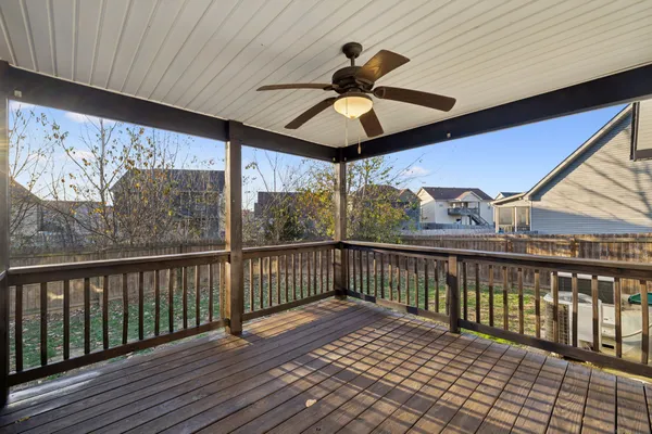 a view of a balcony with wooden floor